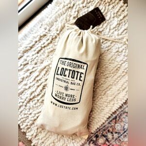 NWT - LOCTOTE - Anti-Theft Sling Back w/Tumbled Brass Lock, Color: Stealth Black